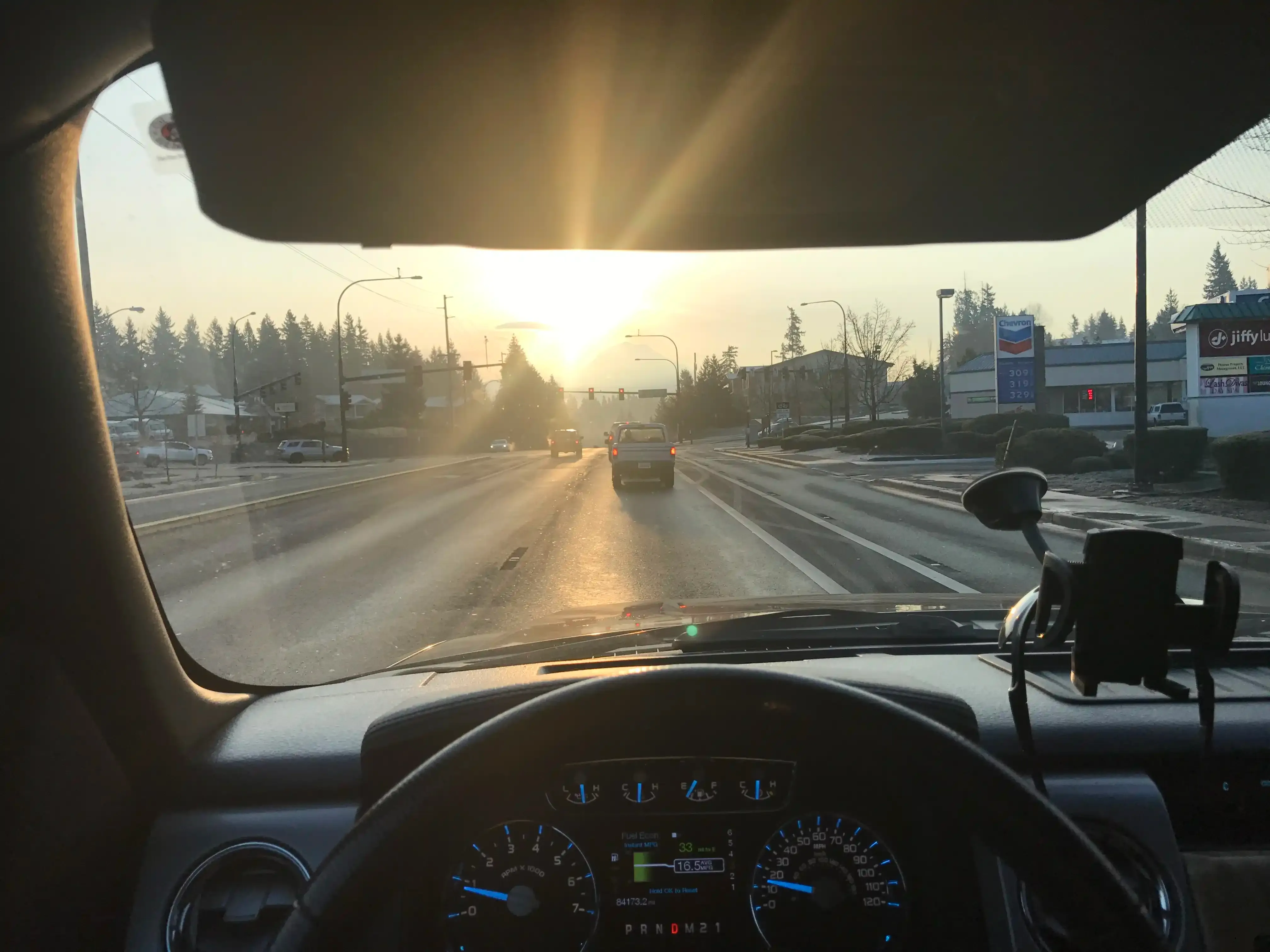 Photo on HWY 410 heading East toward the project, early morning with the sun shining and a faint silhouette of Mt Rainier.