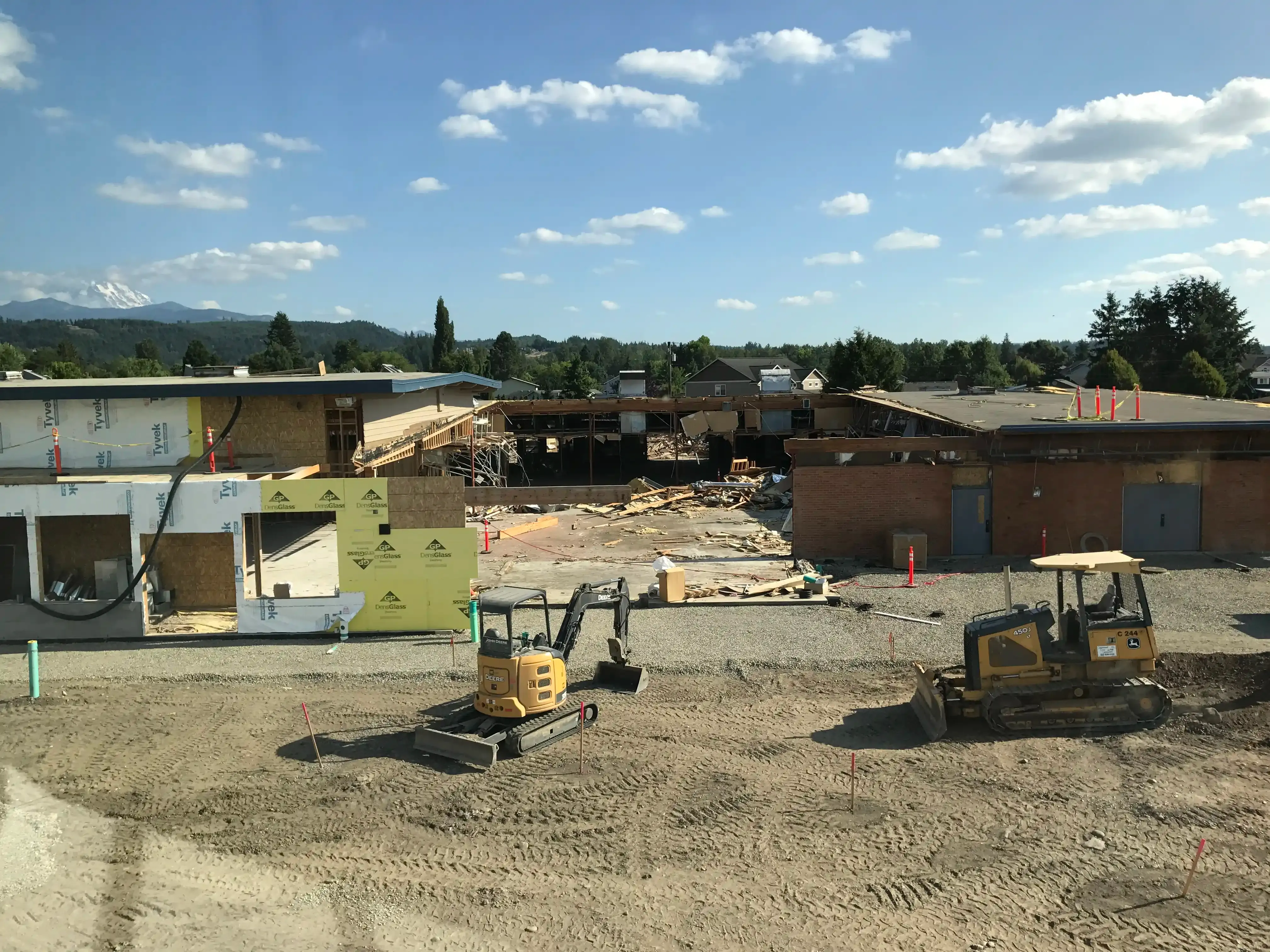 Photo of the existing school with a portion in the middle completely removed to the ground.