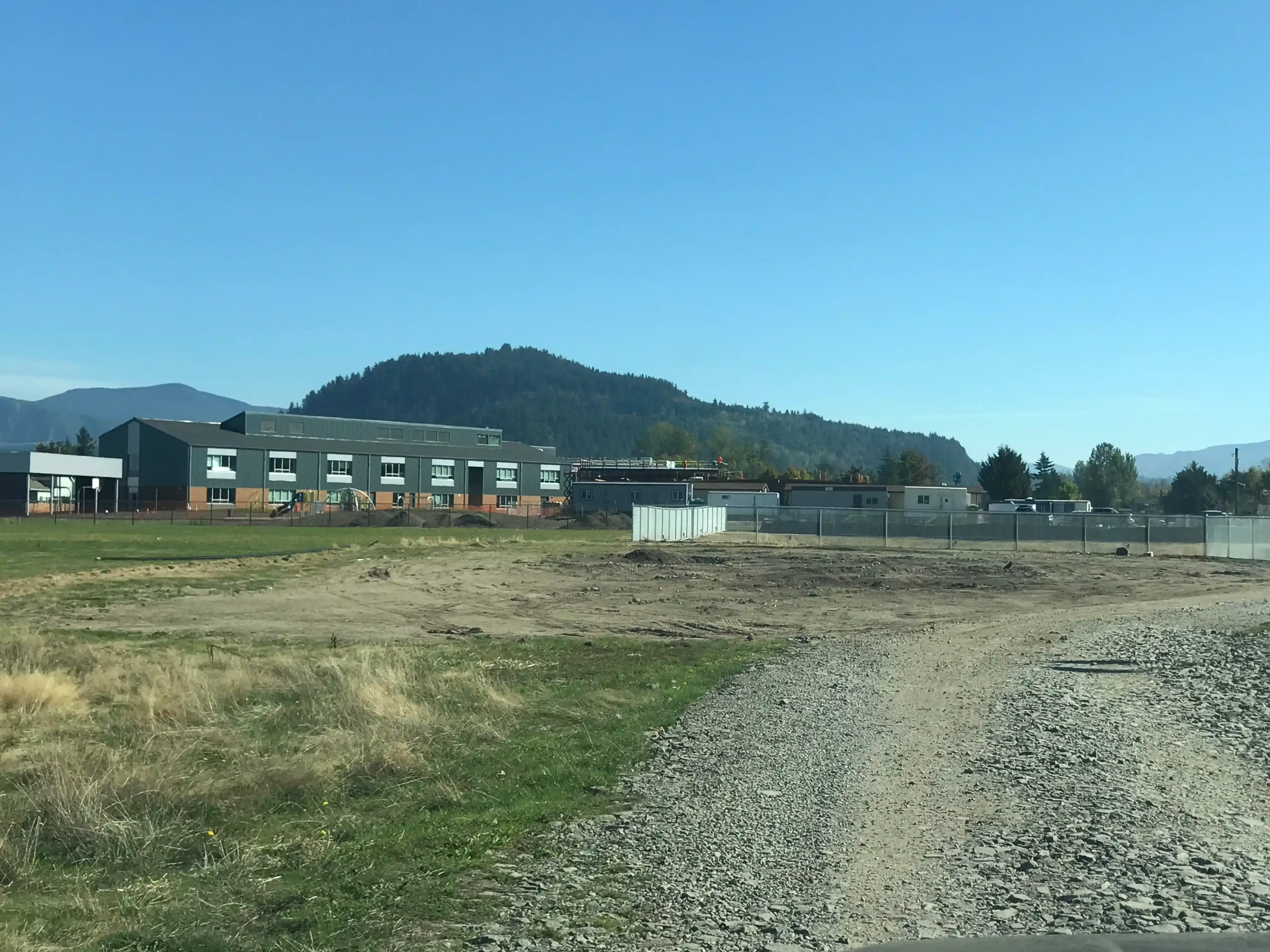 Photo of 'B-wing' roofed and sided from across the large playfield.'
