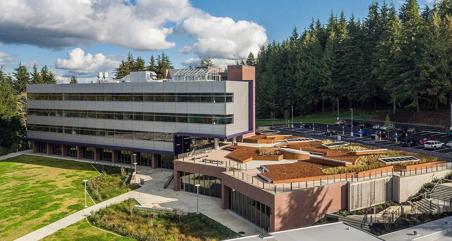 Photo taken from the Northeast direction of the outside of the building, high enough to show the roof-top greenhouse.